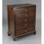 An early 18th century oak chest, with moulded edge to the rectangular top, fitted five long