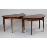 A mahogany dining table with D-shaped end sections with two additional leaves, plain frieze &