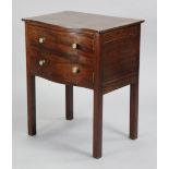 A mahogany serpentine-front cupboard with plain rectangular top, mock drawer-fronts forming the