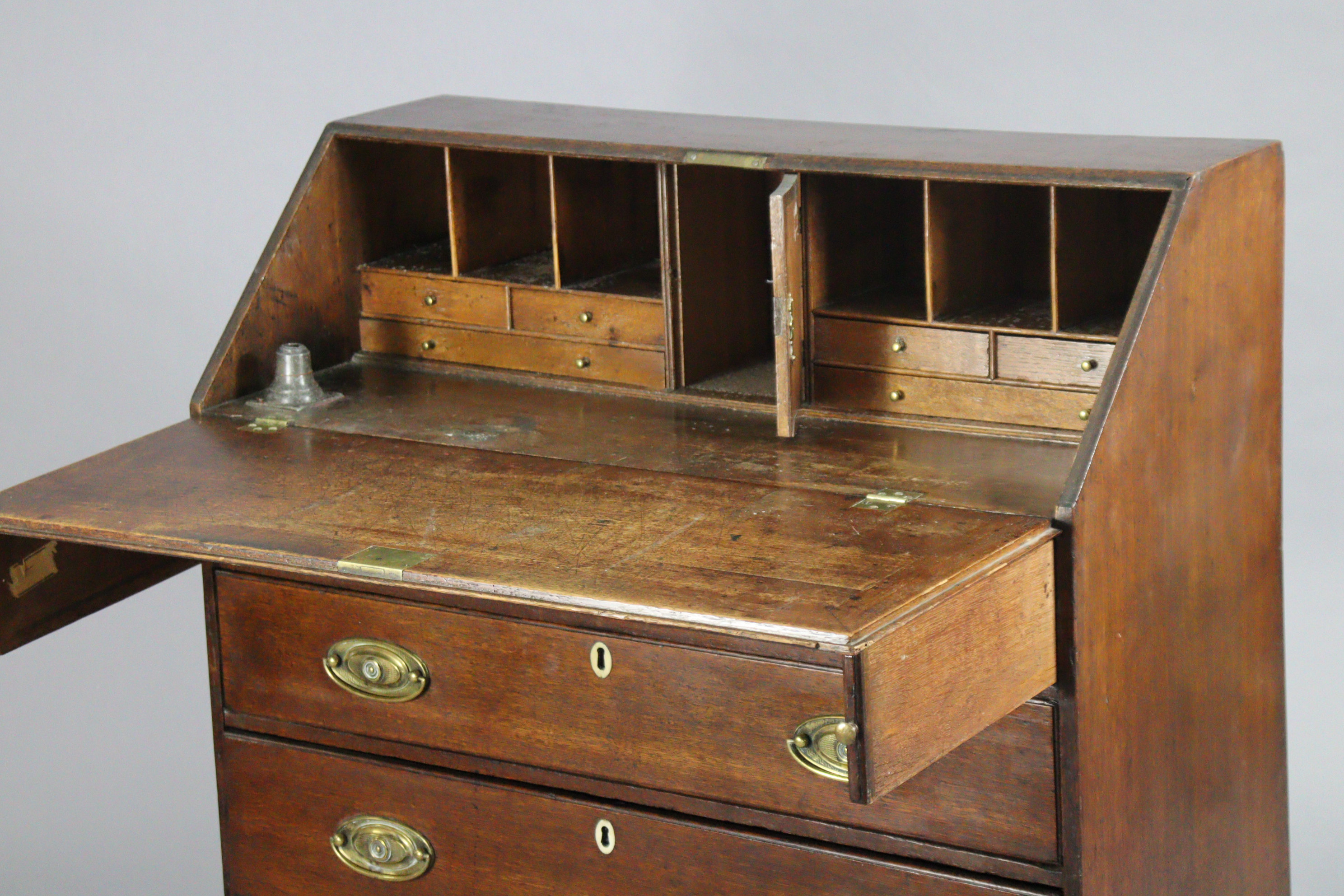 A Georgian mahogany bureau, with fitted interior enclosed by sloping fall-front above four long - Image 2 of 5