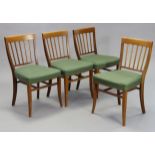 A SET OF FOUR HEAL & SONS OF LONDON 1950s MAHOGANY RAIL-BACK DINING CHAIRS with padded seats, & on