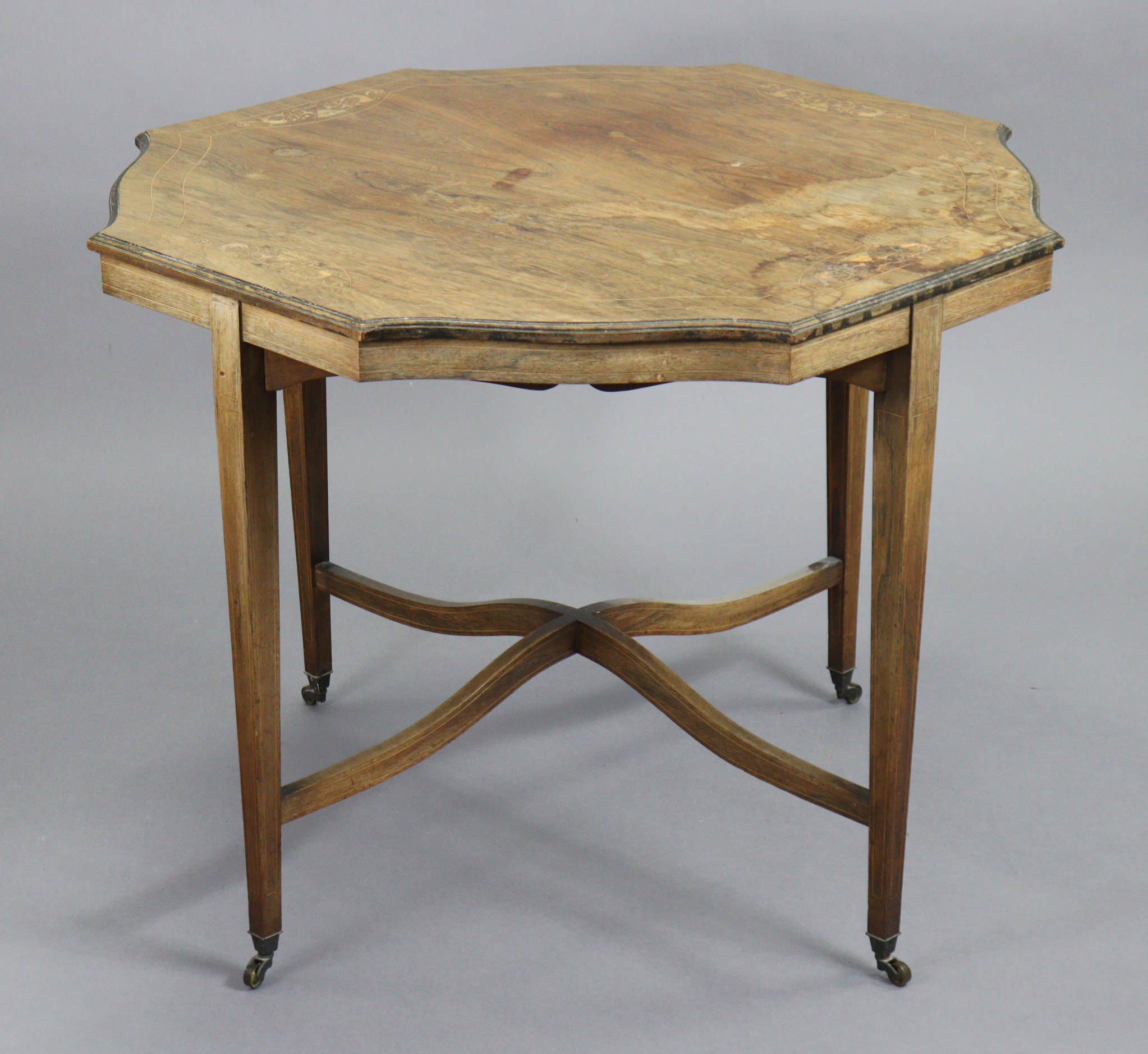 A 19th century inlaid rosewood centre table, with moulded edge to the shaped octagonal top, on