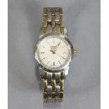 A Tissot ladies’ bracelet watch in stainless steel & gilt, with mother-of-pearl circular dial with