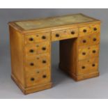 A Victorian satin birch pedestal desk, inset gilt-tooled tan leather to the