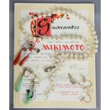 A single row necklace of sixty-seven Mikimoto cultured pearls of uniform size, purchased 1957 from