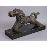 AN INDIAN CARVED WOODEN MODEL OF A LION, with traces of polychrome decoration, 18” long x 10”