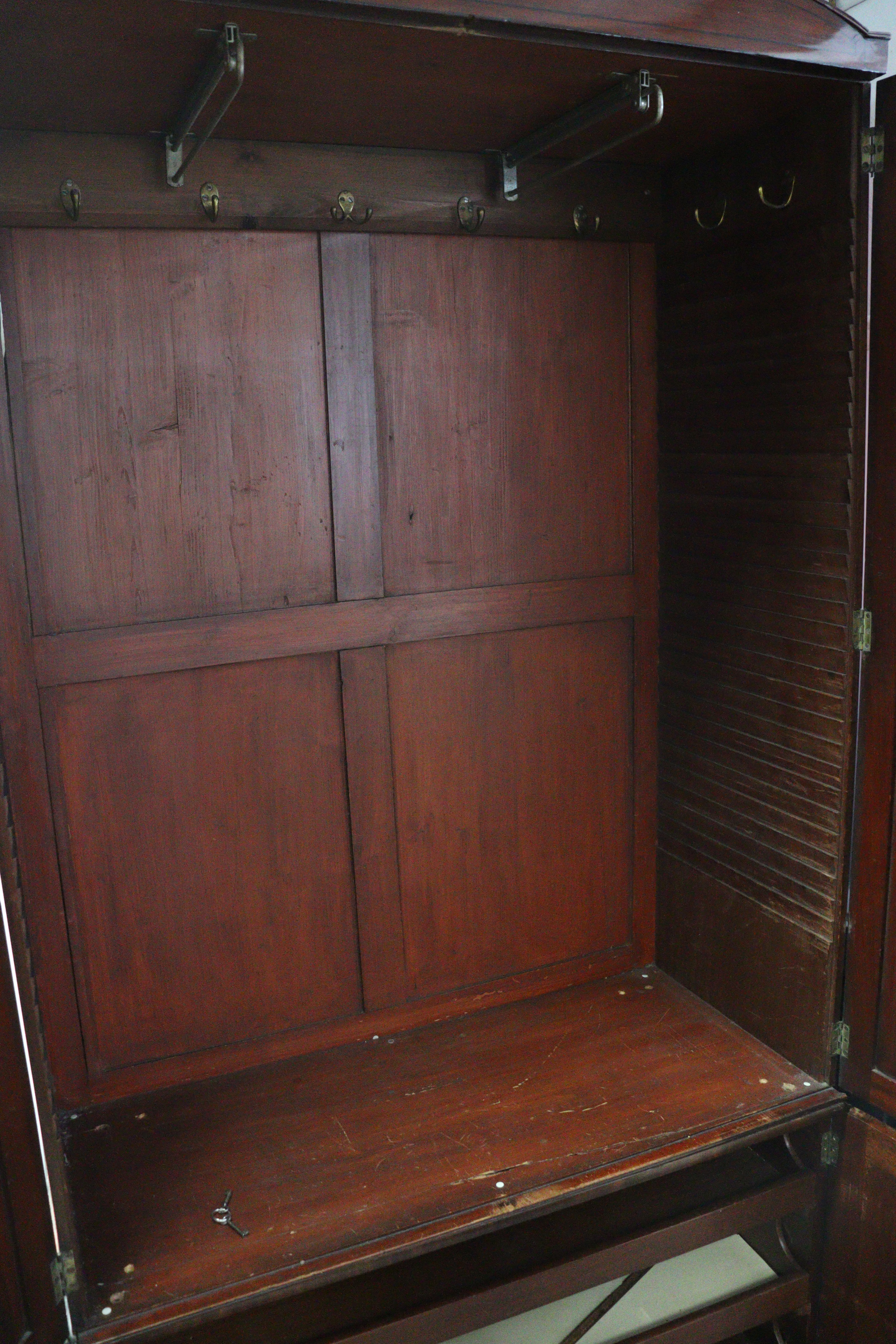 A 19th century inlaid mahogany wardrobe with a hanging compartment enclosed by pair of panel - Image 4 of 7