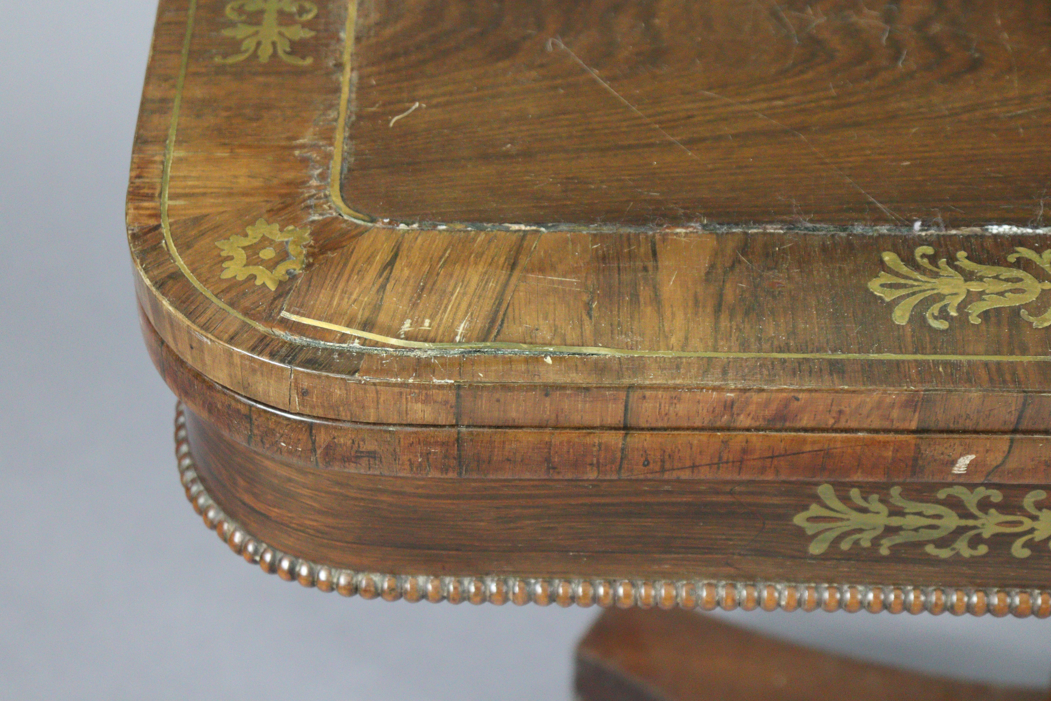 An early 19th century brass-inlaid card table, with rounded corners to the rectangular top, inset gr - Image 3 of 5