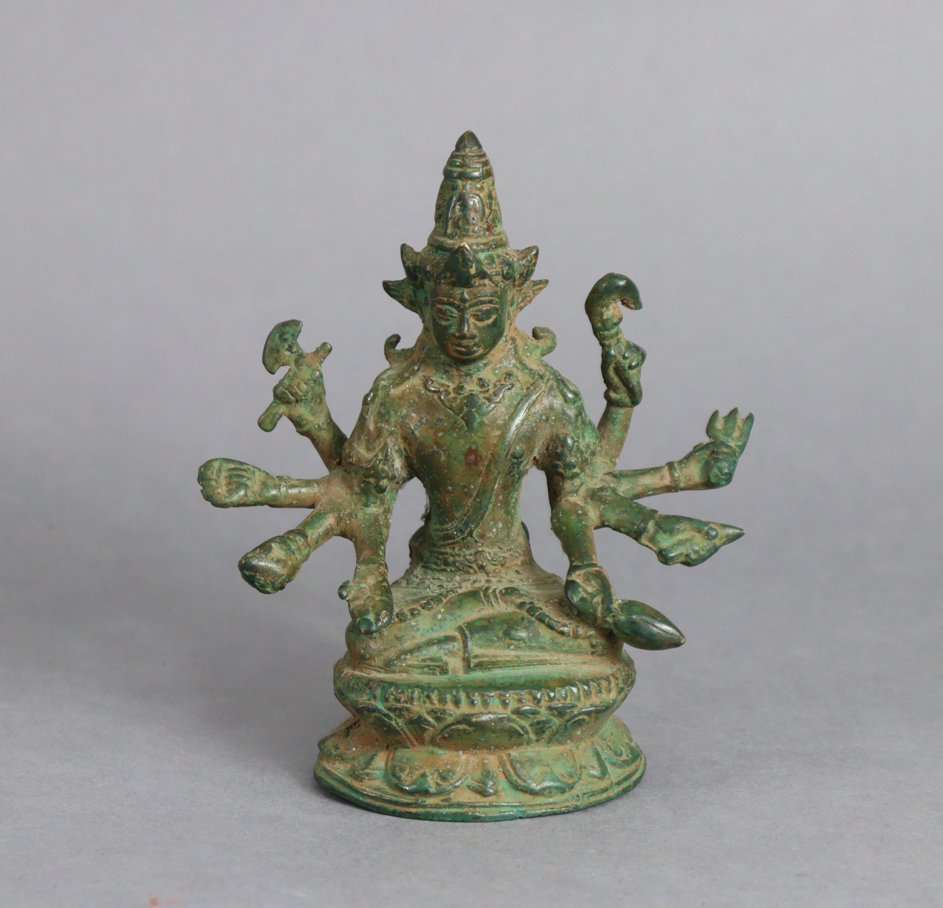 A Sino-Tibetan bronze model of Usnisa Vijaya, seated on double-lotus base, 6” high.