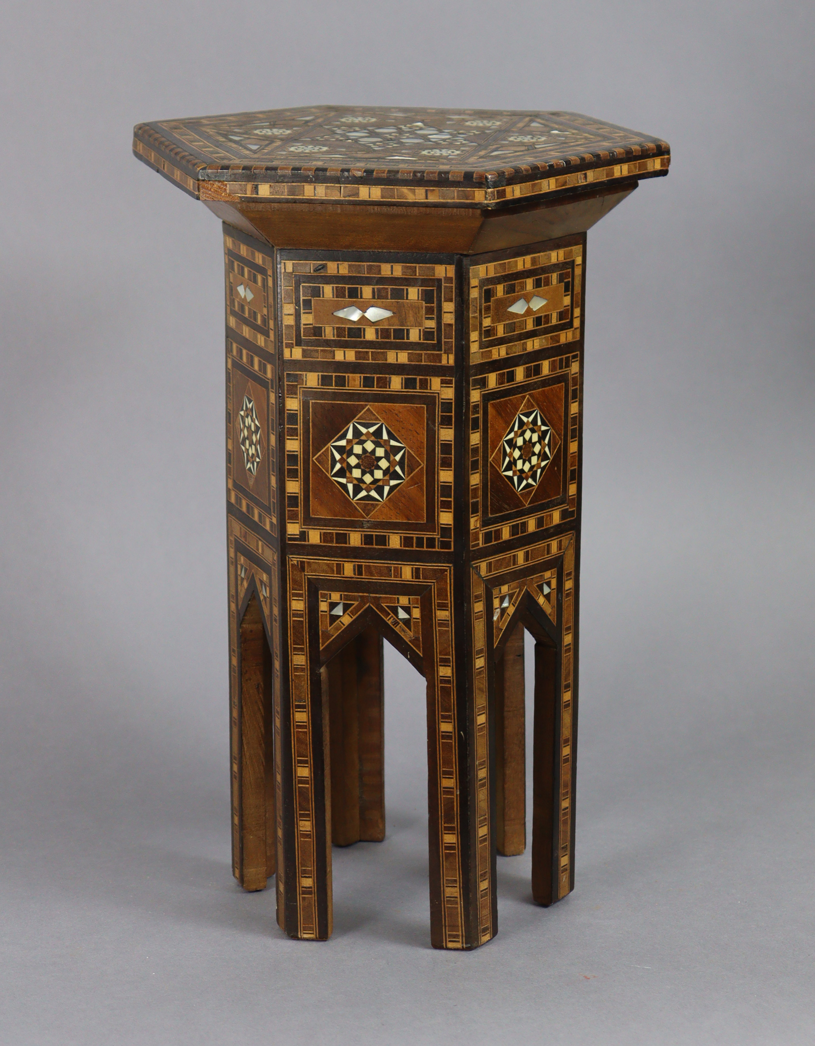 An antique Syrian miniature Damascus occasional table, of hexagonal form with all-over inlaid
