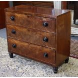 A Victorian mahogany chest with plain rectangular top, fitted three long drawers with ebonised