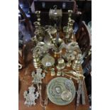 A pair of cast-brass eagle ornaments, 7” high; three pairs of brass candlesticks; & various other