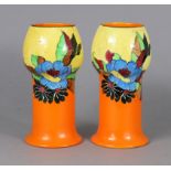 A pair of Wilkinson pottery ‘Indian Summer’ pattern vases with bulbous necks, boldly painted in