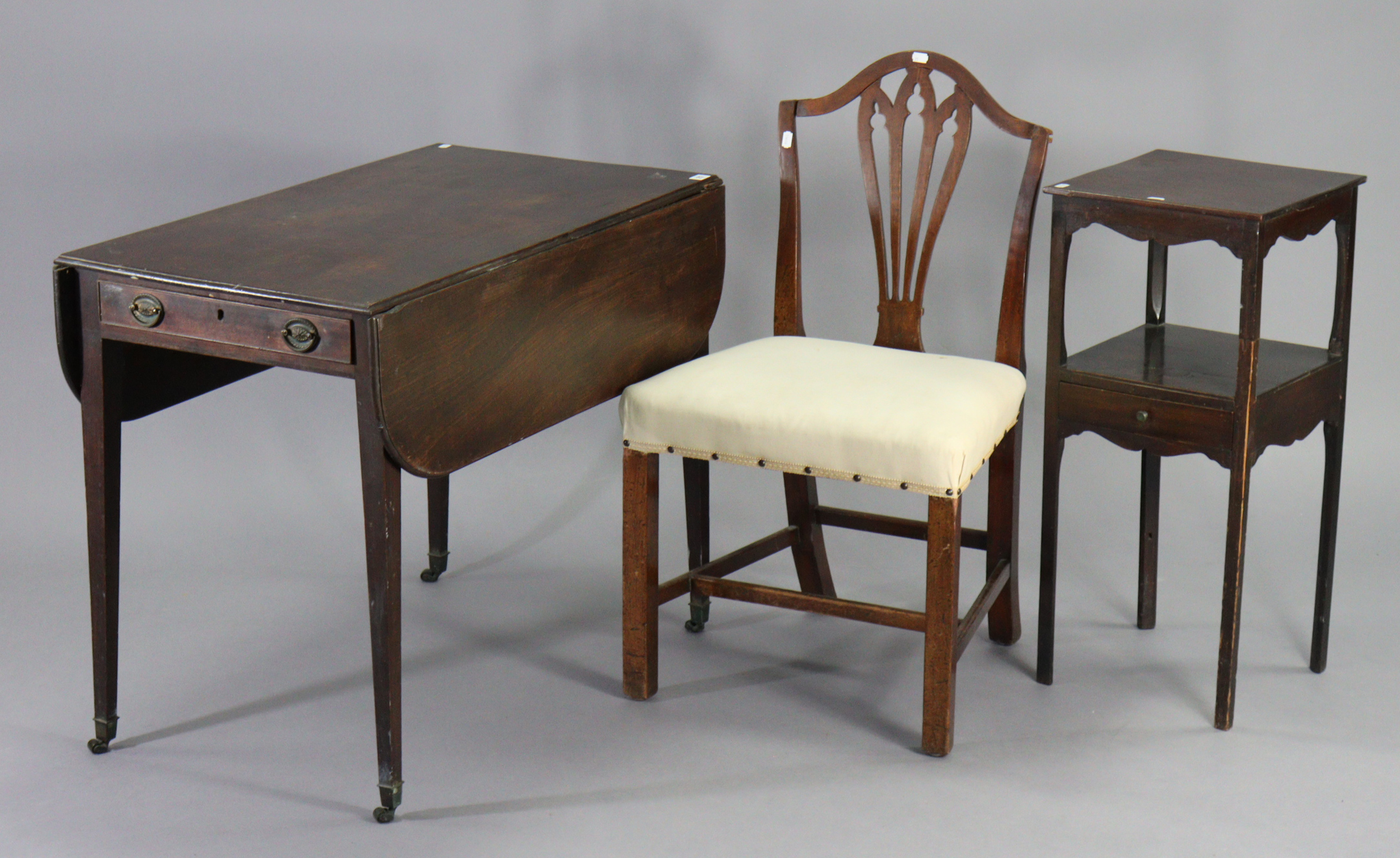 An early 19th century mahogany Pembroke table fitted end drawer & on square legs with brass castors,