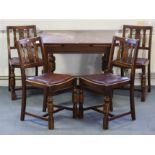 A mid-20th century oak draw-leaf dining table on four bulbous-turned legs with diagonal