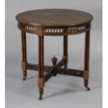 A Victorian mahogany circular centre table with moulded edge & pierced column legs with turned