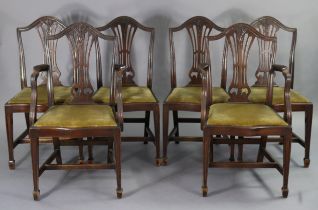 A set of six Hepplewhite-style mahogany dining chairs (including a pair of carvers), each with a