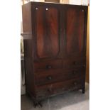An early 19th century mahogany linen press (for restoration) the upper part enclosed by a pair of