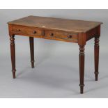 A 19th century mahogany side table fitted two frieze drawers, & on turned & fluted tapering legs,