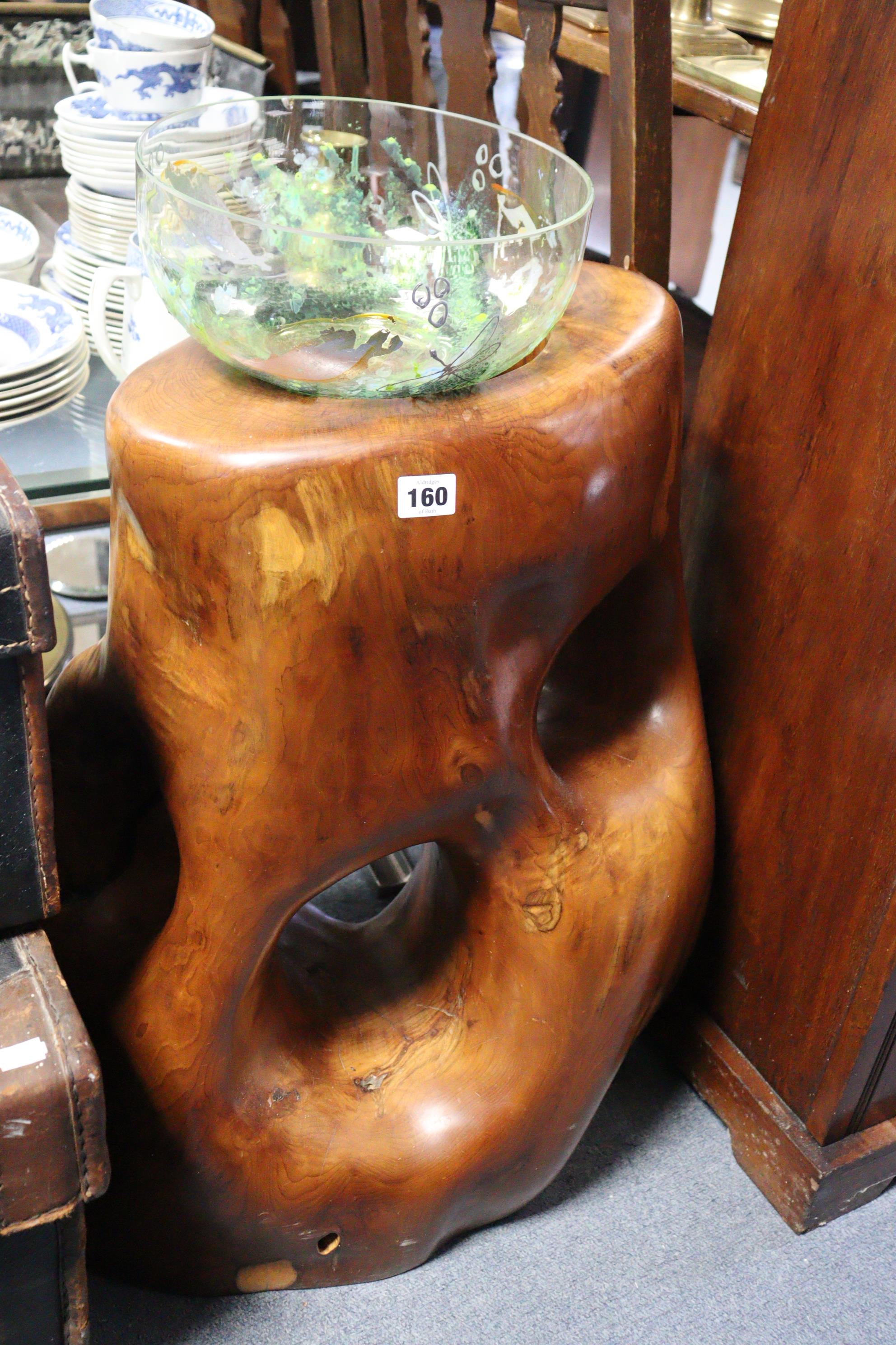 A sculptured hardwood stand inset with a glass bowl, 27” high.