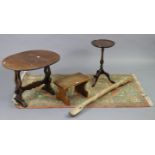 An oak oval drop-leaf occasional table, 20½” wide x 19” high; together with an oak footstool; a