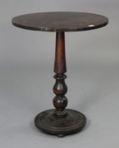 A Victorian mahogany pedestal table with a circular top, & on a vase-turned centre column & a