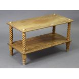 An oak rectangular low tier coffee table with spiral-twist supports & on turned feet, 29¾” wide x