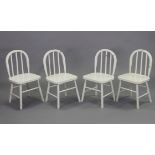 A set of four Windsor-style white painted wooden children’s chairs each with a hard seat, & on round