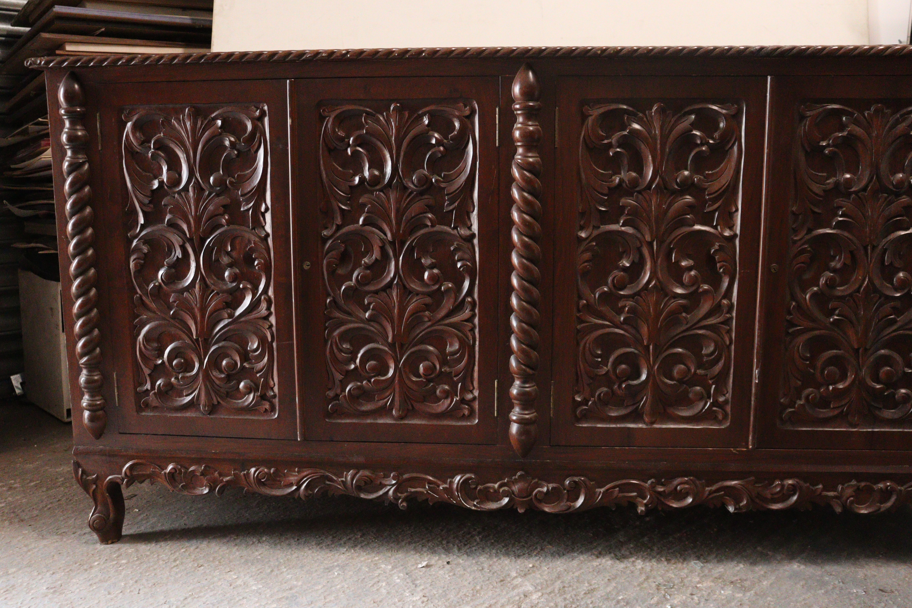 A mahogany sideboard with a gadrooned edge, enclosed by two pairs of carved panel doors, with a - Image 2 of 8