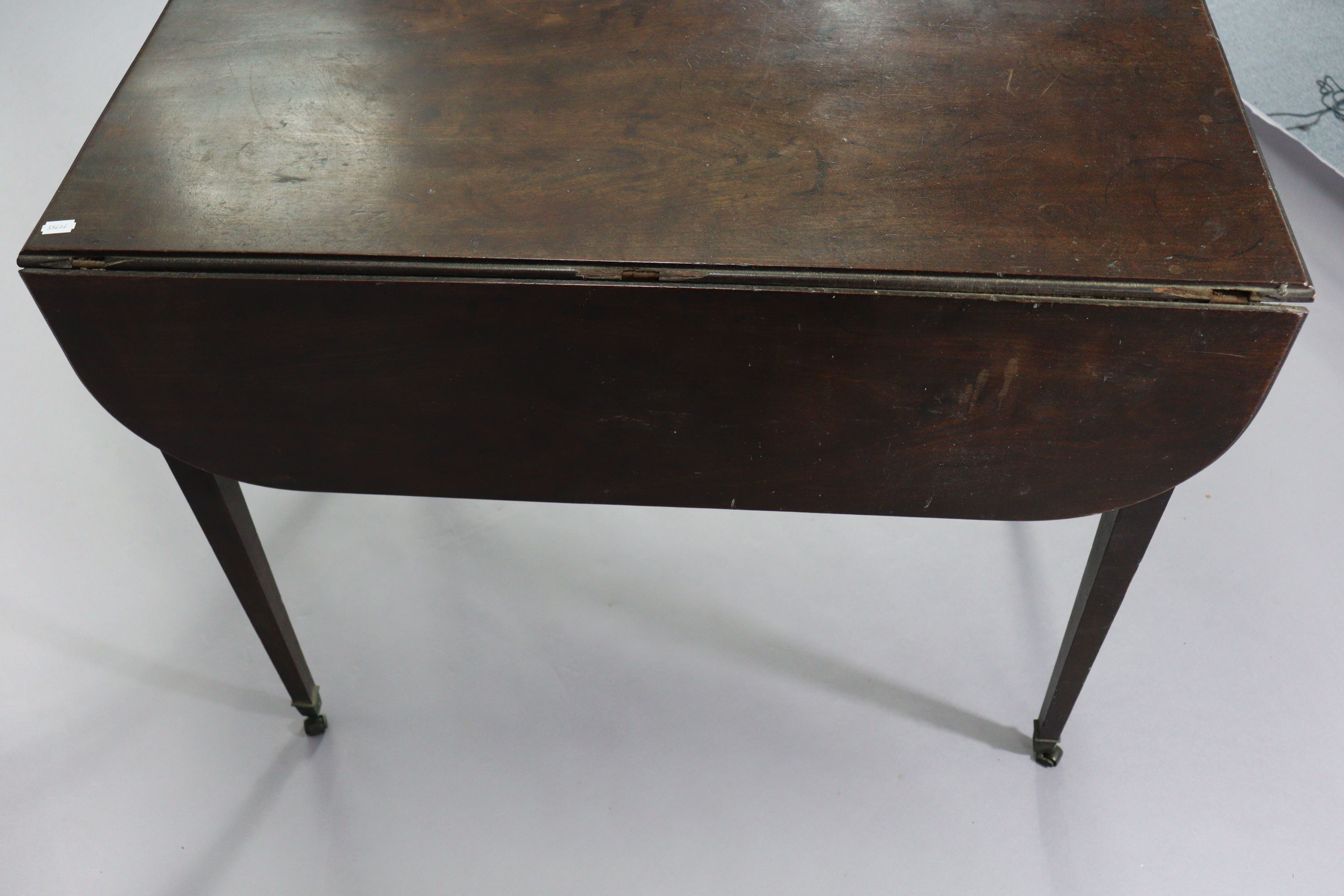 An early 19th century mahogany Pembroke table fitted end drawer & on square legs with brass castors, - Image 4 of 10