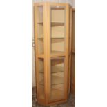A maple-finish tall standing corner cabinet, 30¾” wide x 80” high x 20½” deep