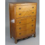 A walnut upright chest fitted five long drawers with iron swing handles, & on turned feet, 34”
