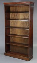 A mahogany tall standing six-tier open bookcase with a moulded Greek-key frieze, & on a plinth base,