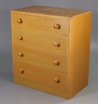 A painted wooden small chest fitted four long graduated drawers with turned knob handles, 29” wide x