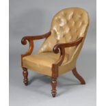 A Victorian mahogany library armchair with buttoned back & padded seat upholstered tan leather,