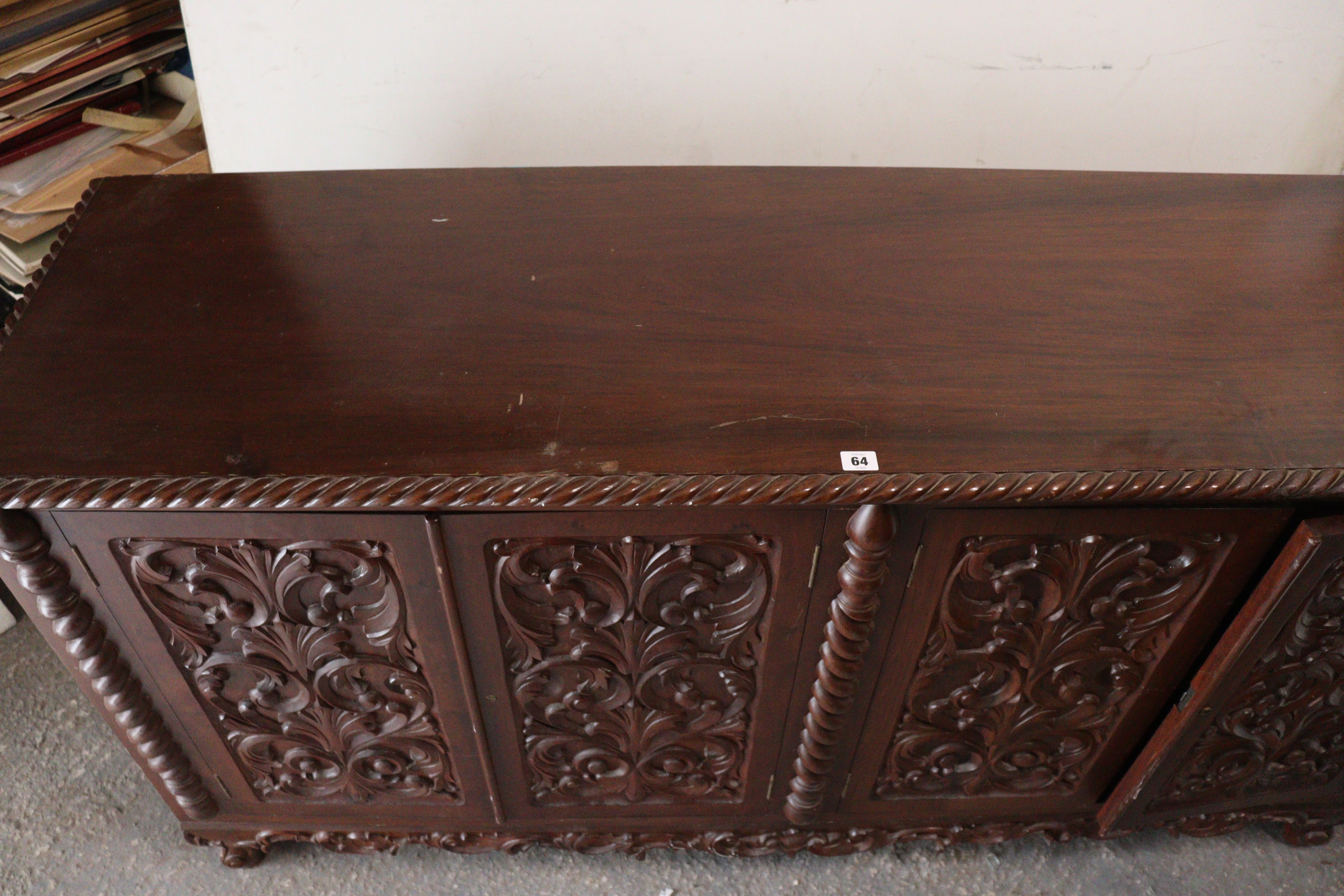 A mahogany sideboard with a gadrooned edge, enclosed by two pairs of carved panel doors, with a - Image 8 of 8