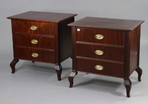 A pair of regency-style mahogany small chests each fitted three long drawers with brass swing