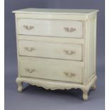 A continental-style off-white painted wooden serpentine-front chest fitted three long drawers with