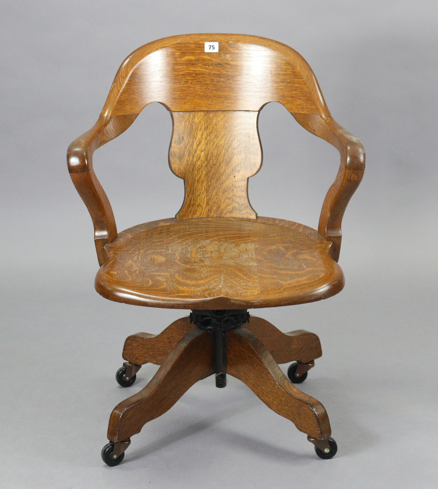 An oak revolving desk chair with a shaped splat back, hard seat & on a sprung base with four splay - Image 2 of 7