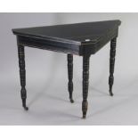 A late Victorian aesthetic-style ebonised & gilt card table inset green baize to the fold-over