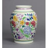 A large Poole Pottery baluster vase painted with flowers in coloured enamels by Gwen Haskins (