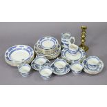 A forty-five piece matched blue & white “Dragon Crescent" dinner & tea service; & a brass candlestic