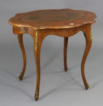 A French-style walnut-inlaid occasional table with a shaped rectangular top, & on four slender