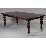 A Victorian-style mahogany dining table, with moulded edge & rounded corners to the plain