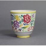 A Poole Pottery jardiniere painted with flowers & birds in pastel shades, printed dolphin mark &