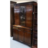 A reproduction inlaid-mahogany tall cabinet, the upper part with three adjustable shelves to