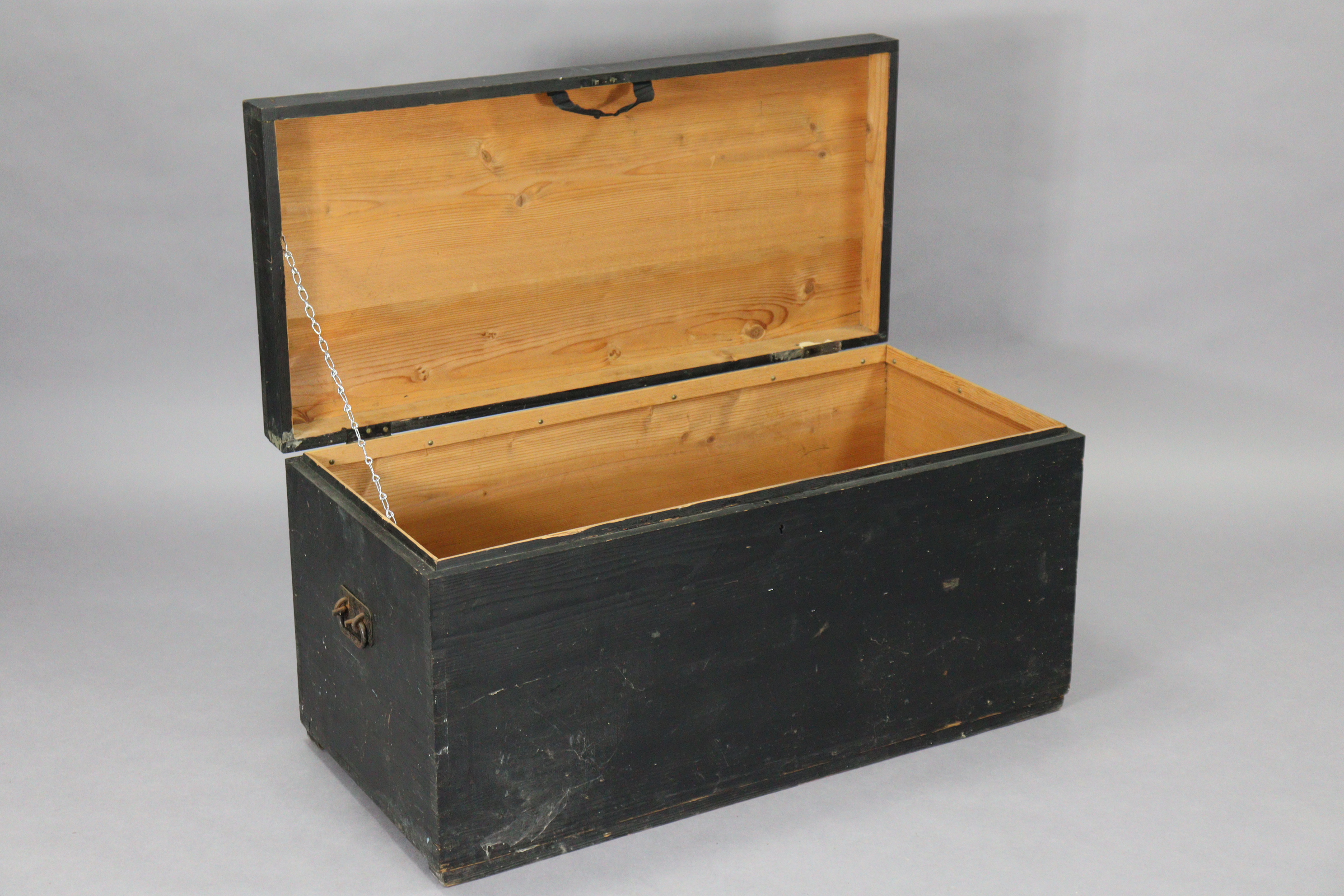 A black painted deal travelling trunk with a hinged lift-lid & with iron side handles, 38” wide; & a - Image 3 of 9