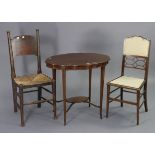 An Edwardian inlaid-mahogany oval two-tier occasional table on four square tapered legs, 30” wide