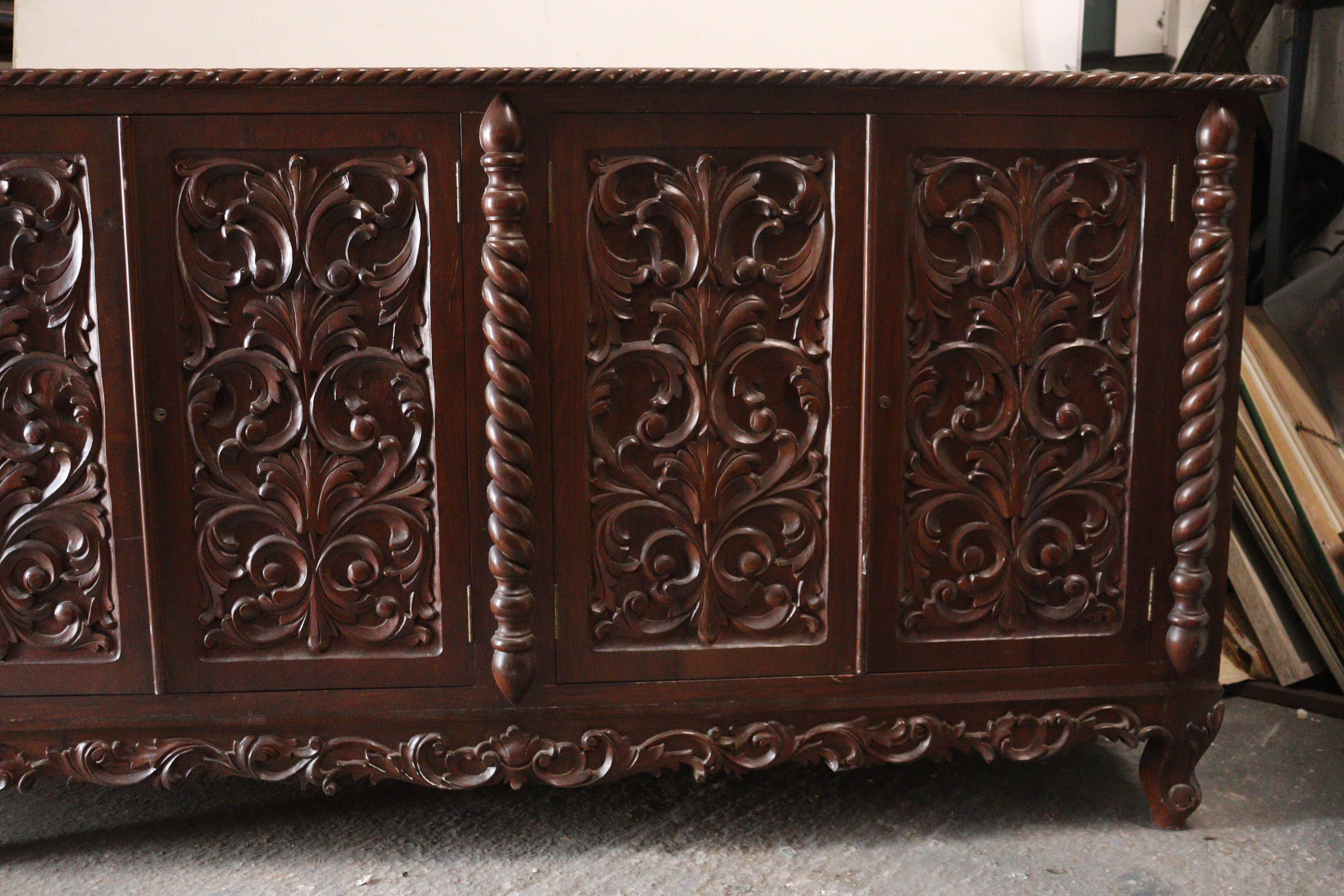 A mahogany sideboard with a gadrooned edge, enclosed by two pairs of carved panel doors, with a - Image 3 of 8