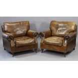 A PAIR OF BRASS STUDDED BROWN LEATHER ARMCHAIRS each with a square back, loose cushion to the seat &